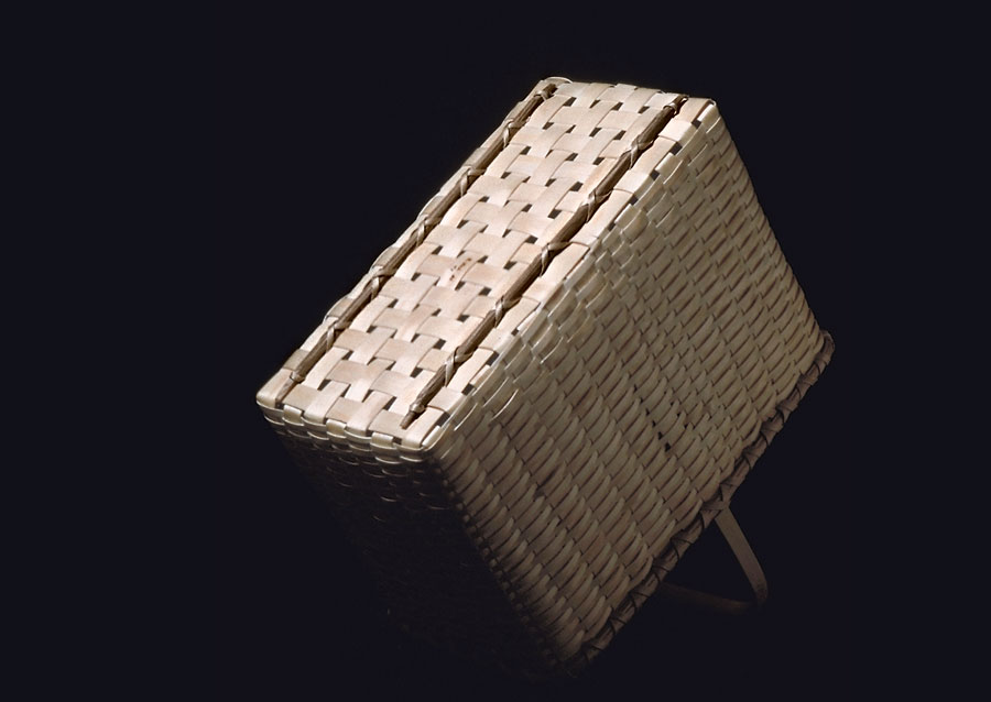 Open Carrier - bottom view. Open carrier rectangular basket with overhead handle. Hand crafted of brown ash by Maine basket maker Stephen Zeh.
