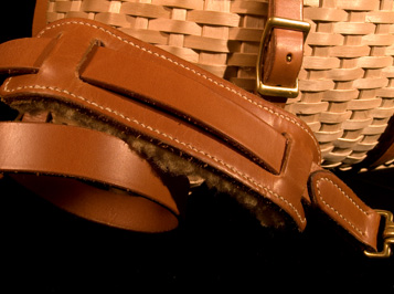 Trout Creel detail showing handsewn leatherwork, a fishing creel basket handcrafted of brown ash and leather by Stephen Zeh