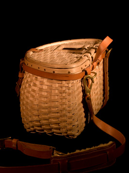 Trout Creel, side view. A fishing creel basket handcrafted of brown ash and leather by Stephen Zeh