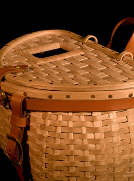 Trout Creel, three quarters view, a fishing creel basket handcrafted of brown ash and leather by Stephen Zeh