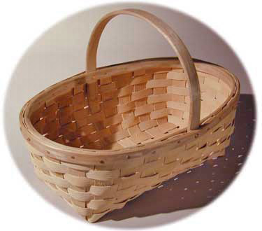 Garden Basket - oval shaped basket with a rectangular bottom. The brown ash splint has the natural texture. The rims are hand split and carved with cut copper clench nails. This basket is hand woven of brown ash (black ash) by Stephen Zeh, Maine basket maker.