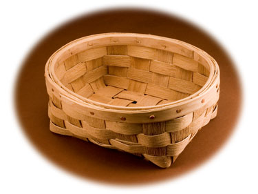 Oval Bread Basket. The brown ash splint has the natural texture. The rims are hand split and carved with cut copper clench nails. This basket is hand woven of brown ash (black ash) by Stephen Zeh, basketmaker of Temple, Maine.