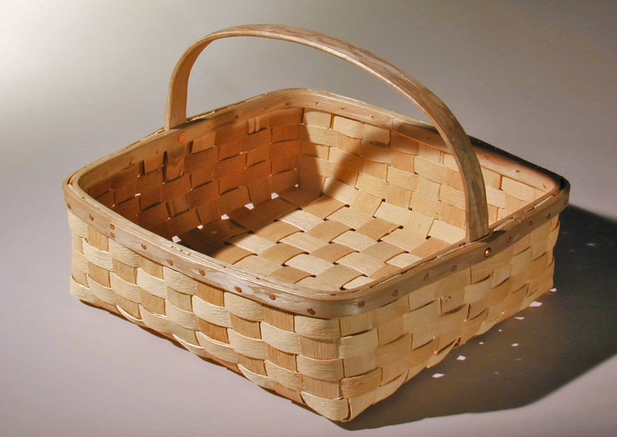 Tomato Basket - shallow square basket with natural textured ash splint. The wide rim is fastened with a row of cut copper clench nails. Hand crafted of brown ash by Maine basket maker Stephen Zeh.