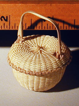 Miniature Covered Swing Handle Basket measured view with inch scale of marking guage.