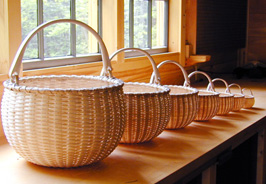 Nesting Set of Seven Swing Handle Baskets , brown ash,  brass by Stephen Zeh