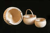 Nesting Set of Three Swing Handle Baskets, brown ash, brass by Stephen Zeh