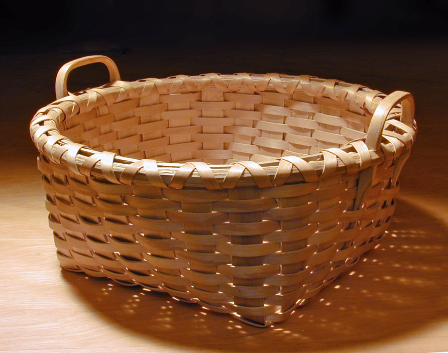 Bread Basket - square bottom to round top. Handcrafted of brown / black ash by Stephen Zeh, Maine basketmaker. 