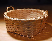 Bread Basket - square bottom to round top. Hand crafted of brown / black ash by Stephen Zeh, Basketmaker of Temple, Maine.