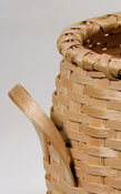 Italian Breadstick Basket - detail showing handle. Hand crafted of brown / black ash by Stephen Zeh, Basketmaker of Temple, Maine.