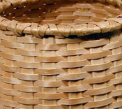 Italian Breadstick Basket - detail showing weave and rim. Hand crafted of brown / black ash by Stephen Zeh, Basketmaker of Temple, Maine.