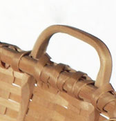 Cracker Basket - detail showing hand carved handle notched securely to rim. Hand crafted of brown / black ash by Stephen Zeh, Basketmaker of Temple, Maine.