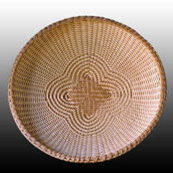 Quadrifoil basket hand woven of fine brown ash by Stephen Zeh basket maker of Temple, Maine.